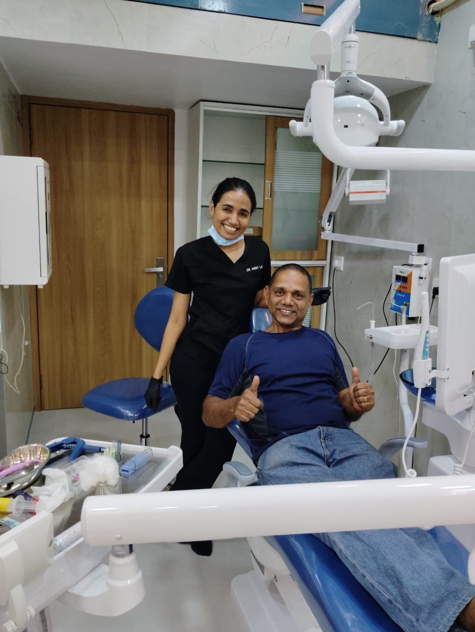 Patient giving thumbs up after treatment