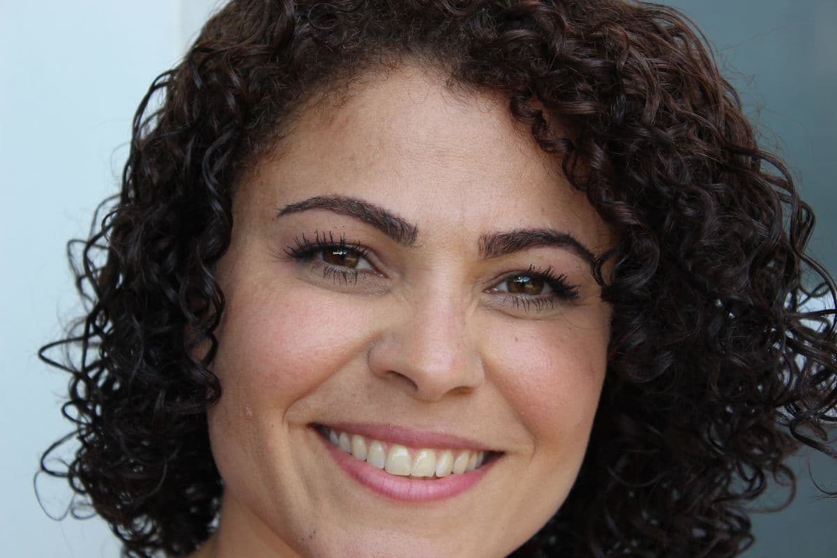 dental veneers Belapur — happy woman with confident natural smile after cosmetic dentistry