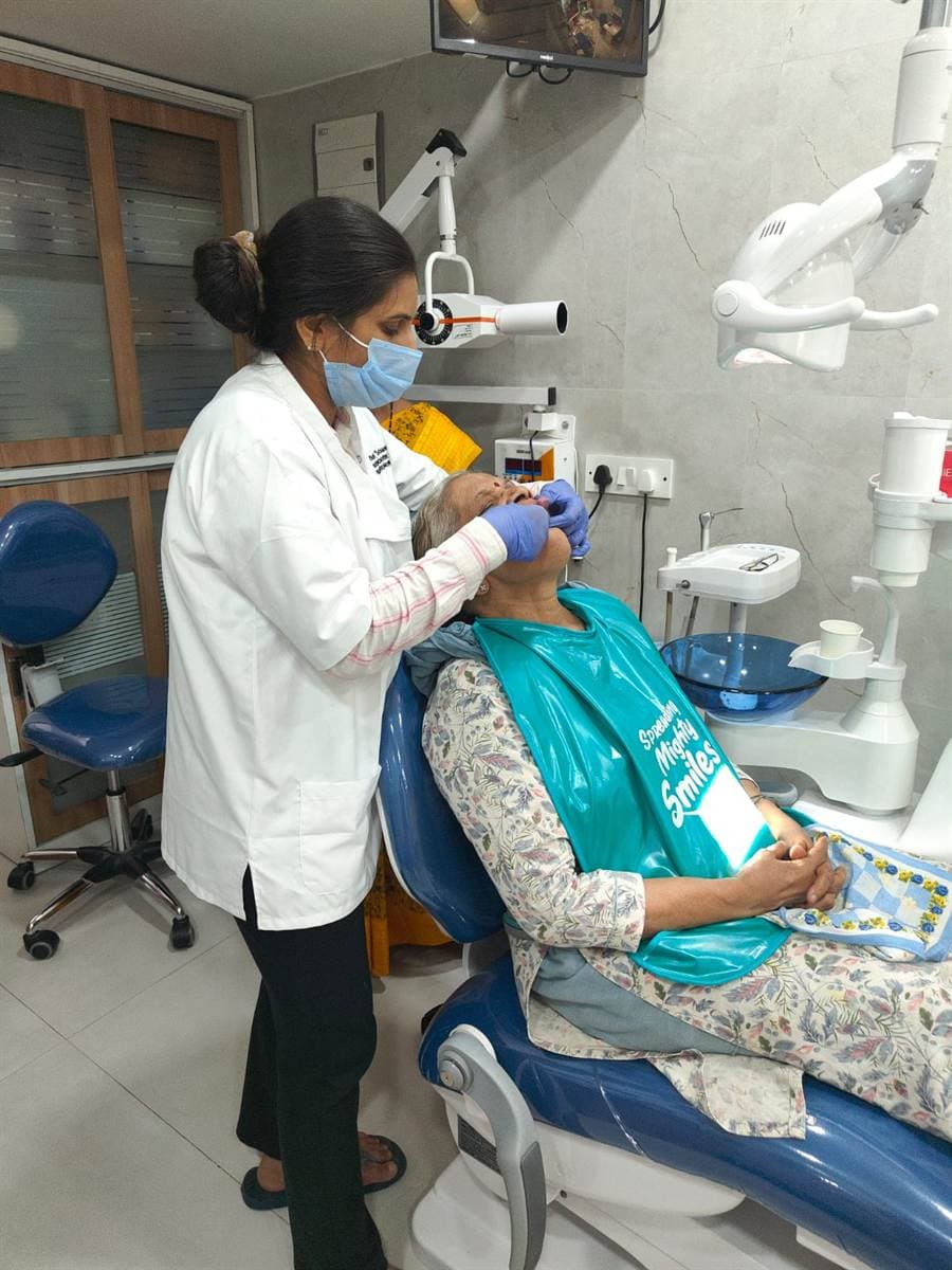 Complete dentures CBD Belapur — a senior patient being treated chairside at Dr. Wendy's Dental Clinic