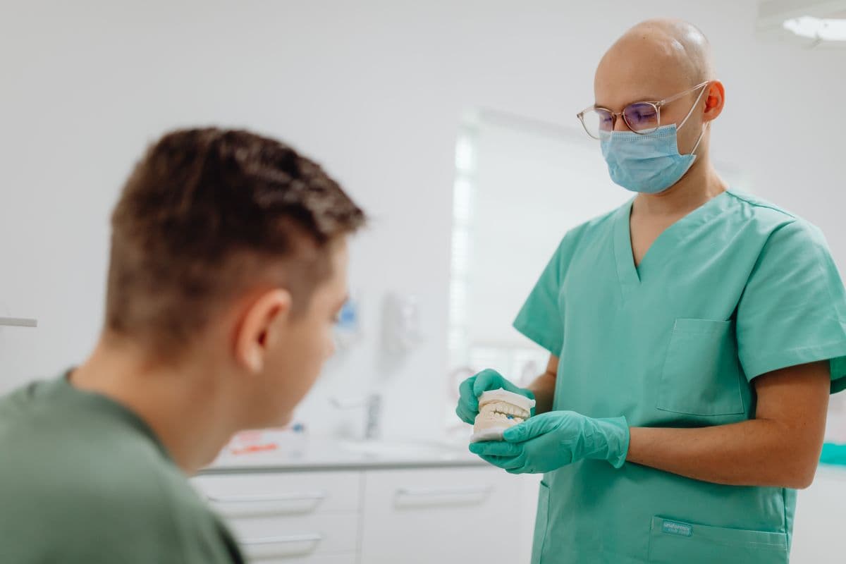 cracked tooth Belapur — dentist explaining treatment options to patient at CBD Belapur clinic