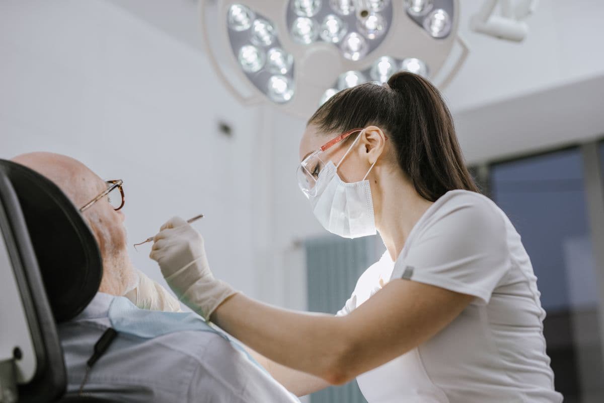emergency dentist CBD Belapur — dentist treating patient at Navi Mumbai dental clinic