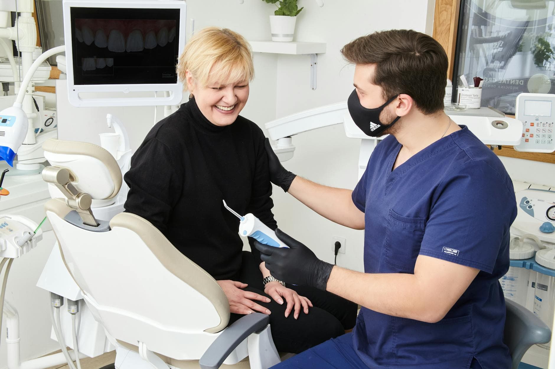 Dental implants consultation CBD Belapur smiling patient modern clinic