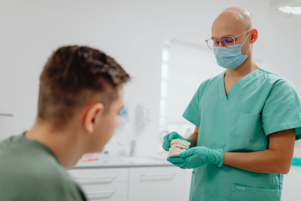 cracked tooth Belapur — dentist explaining treatment options to patient at CBD Belapur clinic