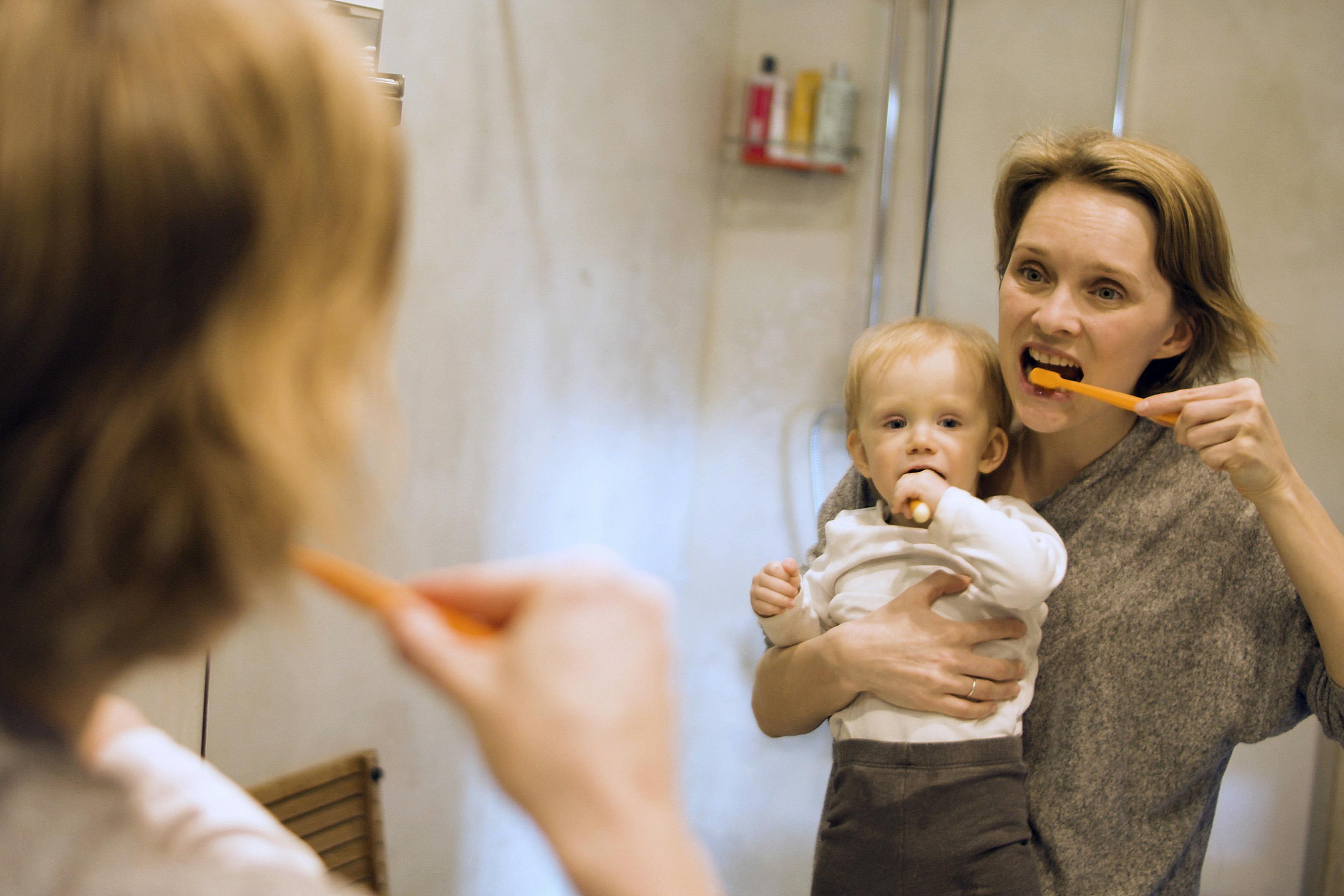 kids dentist CBD Belapur — mother and child brushing teeth together at home